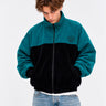 Chaqueta de pana oversize unisex en negro y azul océano, con logo de Loco Monky en el pecho.