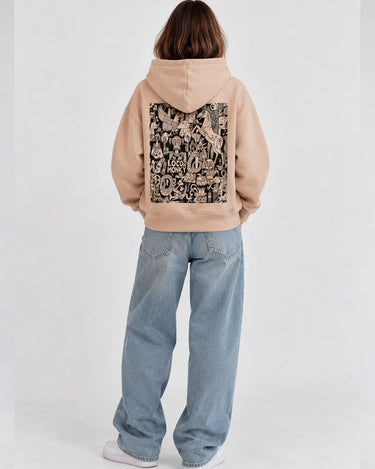 Sudadera unisex color arena con diseño gráfico en la parte posterior, logo de Loco Monky visible.