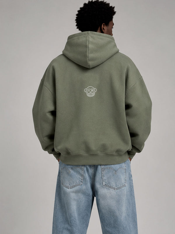 Sudadera boxy unisex en color oliva con capucha y logo de Loco Monky en la parte posterior.