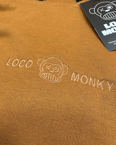 Sudadera oversize Lazy de Loco Monky Brown en color marrón, 100% algodón para un estilo urbano y cómodo.